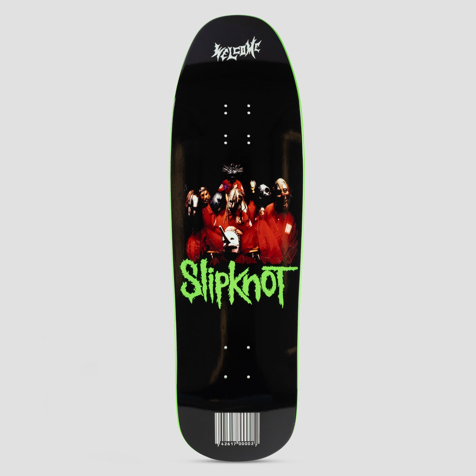 Welcome X Slipknot 9.67 Self-Titled Black / Green Dip skateboard deck: Black shaped deck with a photo of the masked band in red jumpsuits above green dripping 'Slipknot' lettering, a barcode near the tail, and white Welcome logo at the top. Green edge dip.