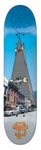 Think Skate Scraper skateboard deck: A photograph of a very tall, narrow pointed tower or skyscraper rising from a street lined with parked cars and low buildings under a blue sky. A small orange logo is at the tail. The image is small and low resolution.