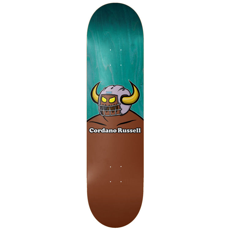 Toy Machine Cordano Russell Holy Spirit 8.50 skateboard deck: The Toy Machine monster with yellow glowing eyes and gold horns wearing a grey American football helmet, on a teal stained top over a brown body, with the name Cordano Russell in white lettering.