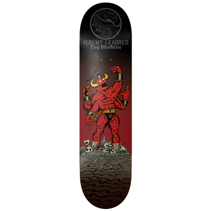Toy Machine Jeremy Leabres Death Fight 8.25 skateboard deck: Muscular red four-armed horned demon flexing on a pile of skulls, with a dragon medallion and Jeremy Leabres Toy Machine lettering at the top, on a black to red fade.