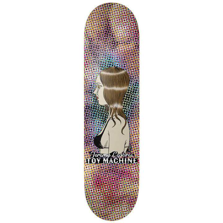 Toy Machine Jeremy Leabres Profile 8.38 skateboard deck: Side-profile illustration of a brown-haired woman in a black bikini top, set against a multicoloured halftone dot background, with the name and Toy Machine in lettering below.