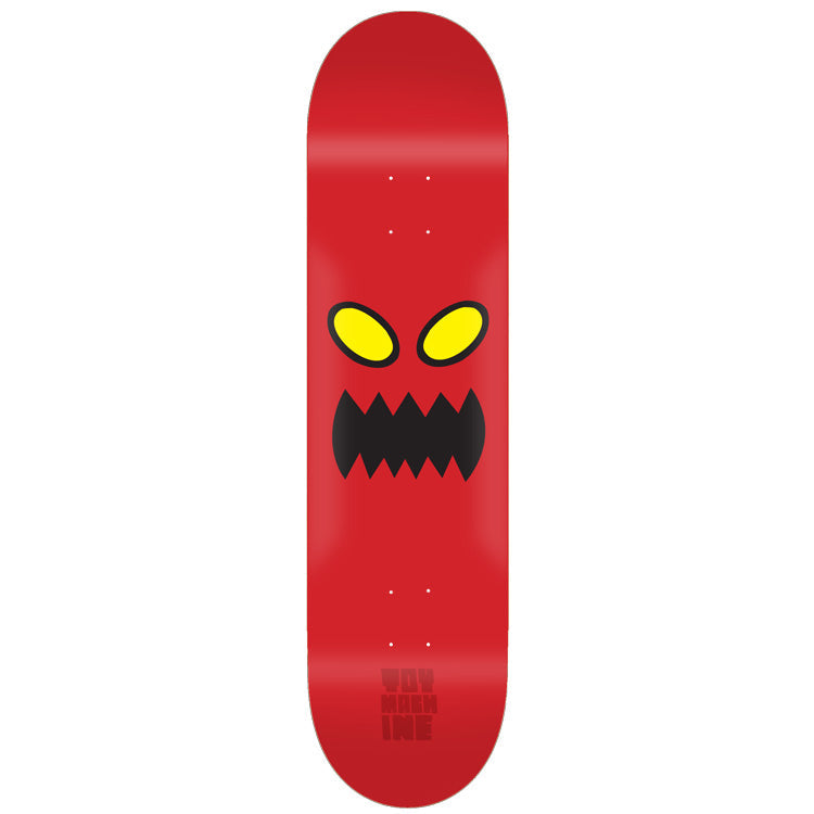 Toy Machine Monster Face 8.00 skateboard deck: Plain red deck with the Toy Machine monster face: two yellow oval eyes with black outlines above a jagged black toothy mouth. Small dark red Toy Machine lettering near the tail.