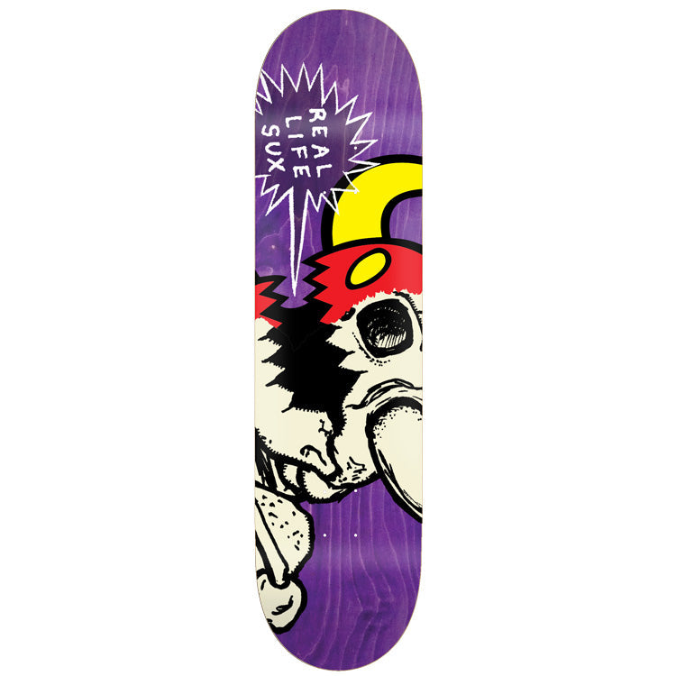 Toy Machine Real Life Sux 8.25 skateboard deck: A cream cartoon monster face with a red cap, yellow horn and a black eye socket is cropped on the deck, with a jagged white speech bubble reading REAL LIFE SUX on a purple stained deck.