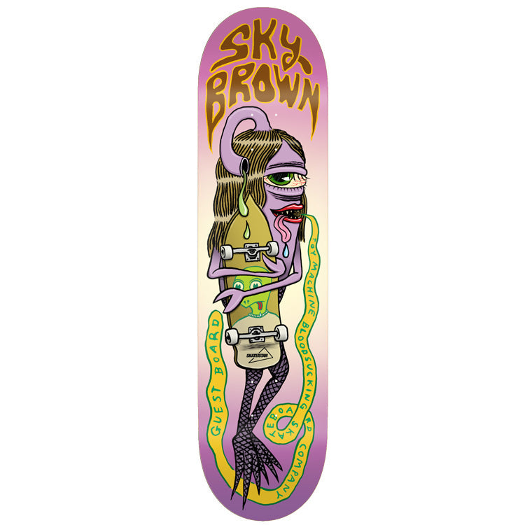 Toy Machine Sky Brown Guest Board 8.25 skateboard deck: A purple one-eyed long-haired creature with a lolling tongue clutches a skateboard that has a green face on it, with a yellow snake looping around it carrying lettering. The rider name is in wobbly brown lettering at the top on a pink and cream fade.