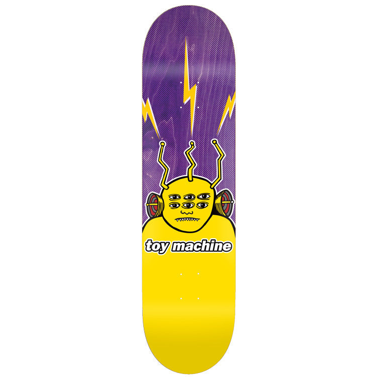 Toy Machine Transmissionator 8.50 skateboard deck: A yellow multi-eyed alien-like character with three antennae and side speakers, with yellow lightning bolts above, on a purple deck whose lower half is solid yellow, with the brand name in a white label.