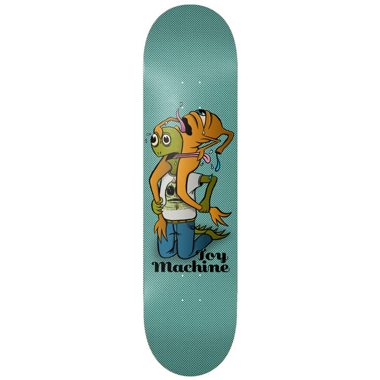 Toy Machine Turtle Boy Fight 8.25 skateboard deck: Cartoon scene of a green-faced turtle boy in a white t-shirt and jeans kneeling, being attacked by an orange tentacled creature on his shoulders that licks his face, on a teal halftone background with the Toy Machine script logo.