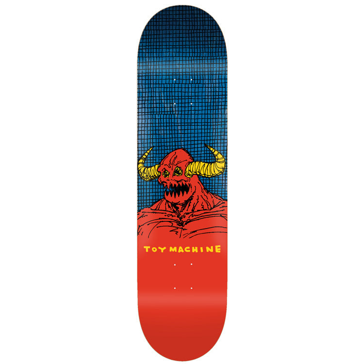 Toy Machine W.t.h. Monster 8.25 skateboard deck: Hand-drawn red horned monster with yellow horns, sharp teeth and a hunched muscular body, against a blue grid-patterned top half, fading into solid red below with the brand name in yellow.
