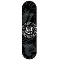 Foundation Seal Decks skateboard deck: Foundation Skateboards circular seal in the style of a presidential crest, with an eagle and shield, on black with faint grey eagle and ornamental shapes behind.