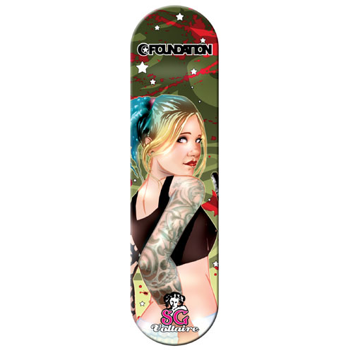 Foundation SG Series 2 Leo Voltaire skateboard deck: A pin-up style illustration of a blonde woman with blue ponytail and a tattooed sleeve looking back over her shoulder, against a camouflage background splattered with red and scattered with white stars. Brand logo at top, SG Voltaire signature at the foot.