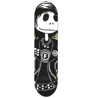 Foundation Corey Duffel Skellington 2 skateboard deck: A white skull-faced Skellington-style figure with stitched mouth, black eyes and a dark fringe, wearing a black studded vest with an F emblem, chain necklace and patches. Mostly black and white.
