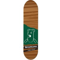 Toy Machine Layton Betard skateboard deck: Wood-grain brown deck with a green panel at the tail holding a white line drawing of a bear-like head and shoulders with an open mouth. Toy Machine label in a black strip below.