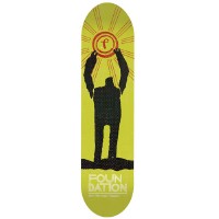 Foundation Nguyen Heroes Fiberlam skateboard deck: Black silhouette of a figure with raised arms holding up a Foundation 'f' emblem like a sun with orange rays, on a lime green background. Foundation lettering at the base.