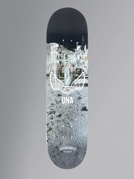 Unabomber No Apollo Series - Walk skateboard deck: Photograph of the moon's surface with a lunar vehicle and tyre tracks under a black sky, overlaid with a white winged clasped-hands emblem above the letters UNA.