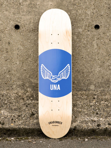 Unabomber Spot - Cobalt Blue skateboard deck: Natural maple deck with a large cobalt-blue circle containing a white outline of two wings joined by a handshake, with UNA beneath. Unabomber Skateboards text sits at the tail.