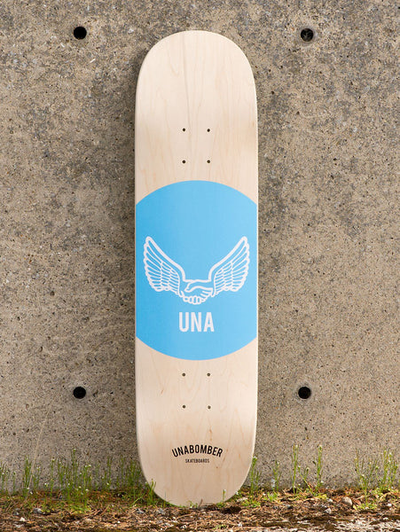 Unabomber Spot - Dusk Blue skateboard deck: Natural maple deck with a large light blue circle holding a white outlined pair of wings joined by a handshake, with UNA beneath. Unabomber Skateboards wordmark sits near the tail.