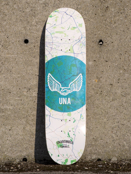 Unabomber John Bell Map skateboard deck: Light street map of Stockport in pale blue and green with a large teal circle behind a winged handshake outline and UNA lettering. Unabomber and rider name at the foot.