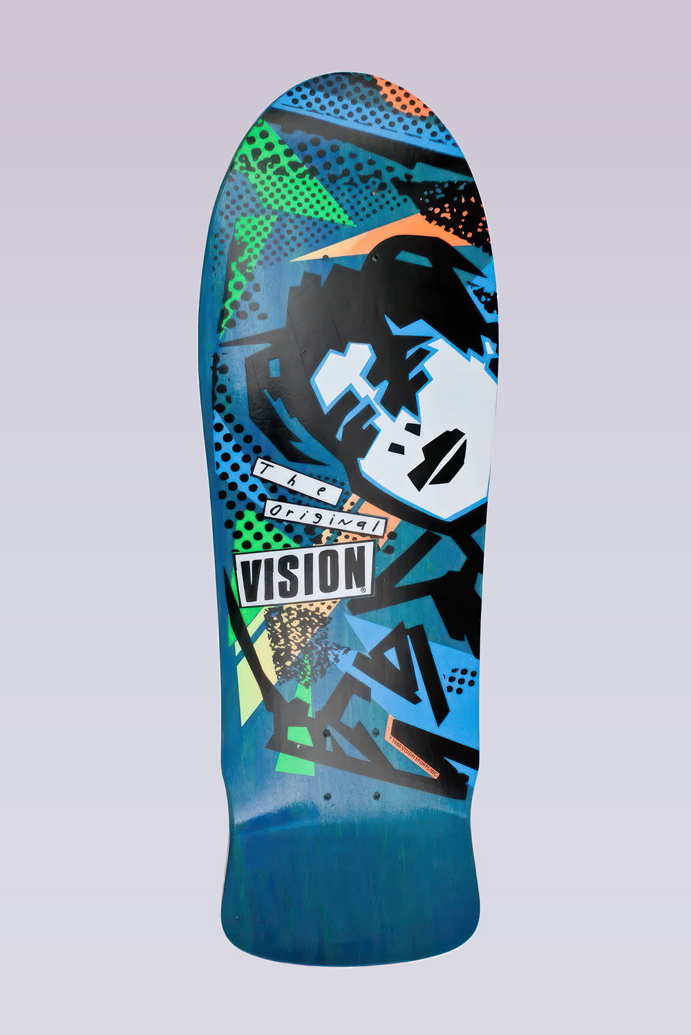 Vision Street Wear MG - Modern Concave - Blue skateboard deck: Old-school shaped deck with an angular black and white cut-out face of a figure with dark hair, set among neon green and orange triangles and halftone dots on blue-stained wood. The Original Vision label sits in the middle.