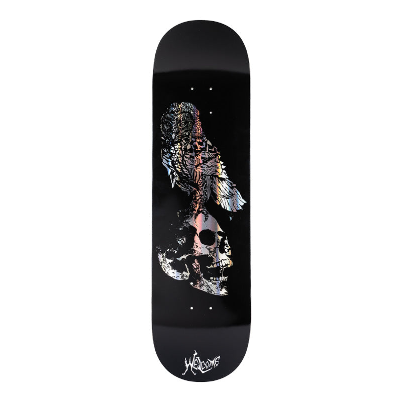 Welcome Bird Brain on Evil Twin 875 - Black/Prism Foil - 8.75 skateboard deck: Black deck with a detailed patterned owl perched on a cracked skull, printed in holographic prism foil. The Welcome logo is in white at the tail.