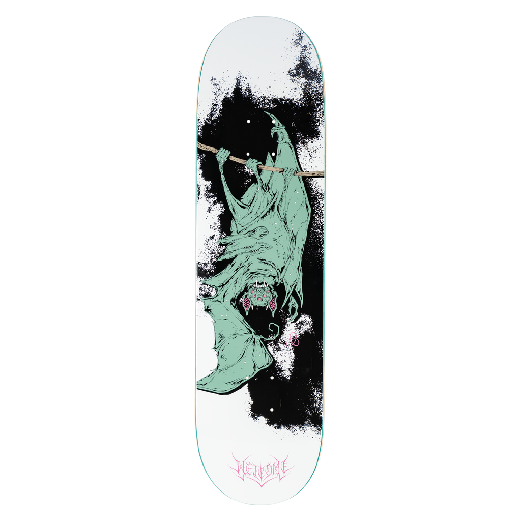 Welcome Infinitely Batty on Popsicle - White/Black skateboard deck: A pale green bat hangs upside down from a branch, with many eyes and fangs, against a black ink splatter on a white deck. Pink gothic brand lettering sits at the tail.