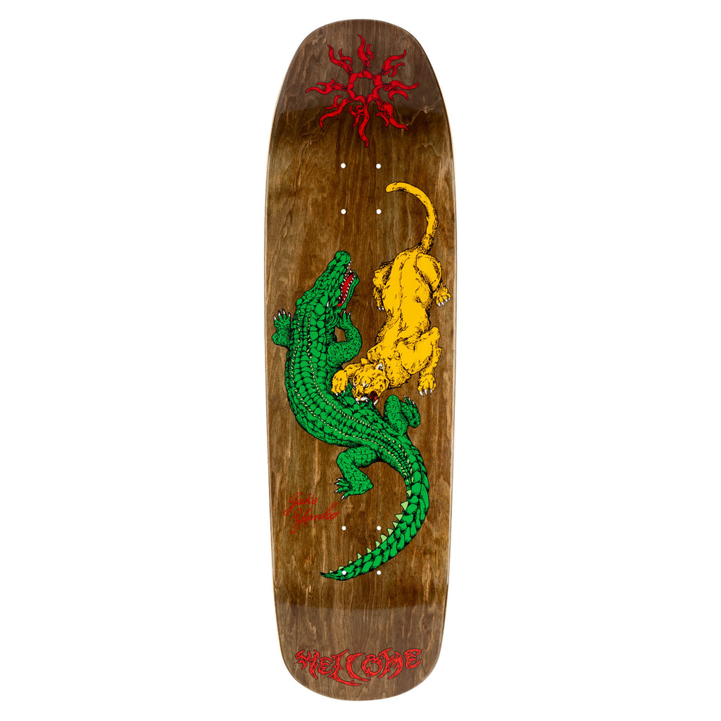Welcome Jake Yanko Swamp Fight on Panther - Brown Stain skateboard deck: A green alligator and a yellow panther locked in a fight, drawn in a line-engraved style on a brown stained wood deck, with a red tribal sun at the top and a red signature and Welcome lettering.