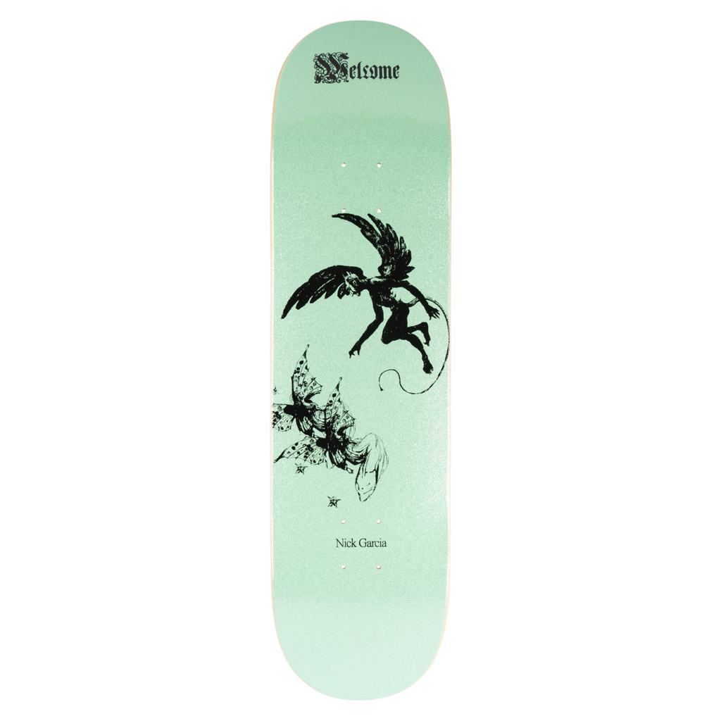 Welcome Nick Garcia Paradox on Popsicle - Mint Glitter skateboard deck: Black ink drawing of a winged, horned imp with a curling tail swooping above a cluster of butterfly-like moths, on a pale mint glitter ground. Gothic blackletter logo at the top and rider name near the bottom.