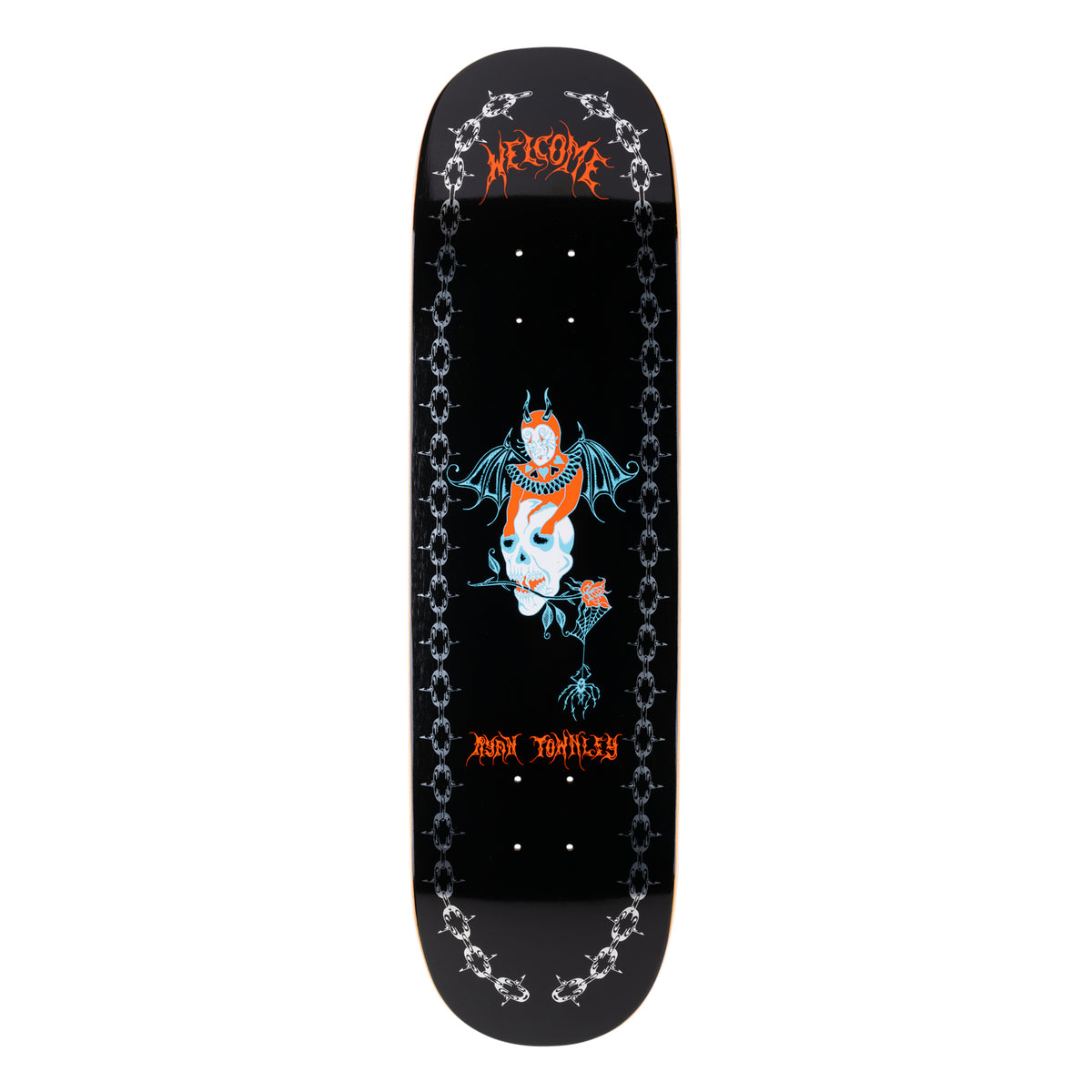 Welcome Ryan Townley Angel on Enenra - Black/Silver Foil - 8.5 skateboard deck: Red and white winged devil figure with a bat wings perched on a skull with a rose in its teeth and a spider hanging below, between silver chain borders on black. Welcome gothic lettering at top.