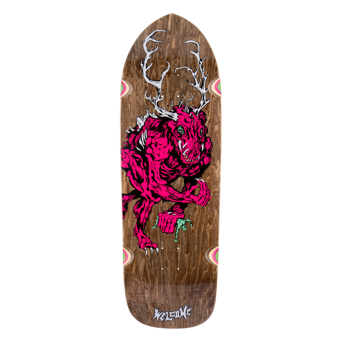 Welcome Wendigo on Magic Bullet 2.0 - Brown Stain - 10.5 skateboard deck: Hunched pink antlered wendigo creature with fangs and claws, holding a tiny green figure, drawn over brown-stained wood on a shaped old-school deck. Small pastel swirl details on the side edges and a Welcome logo at the tail.