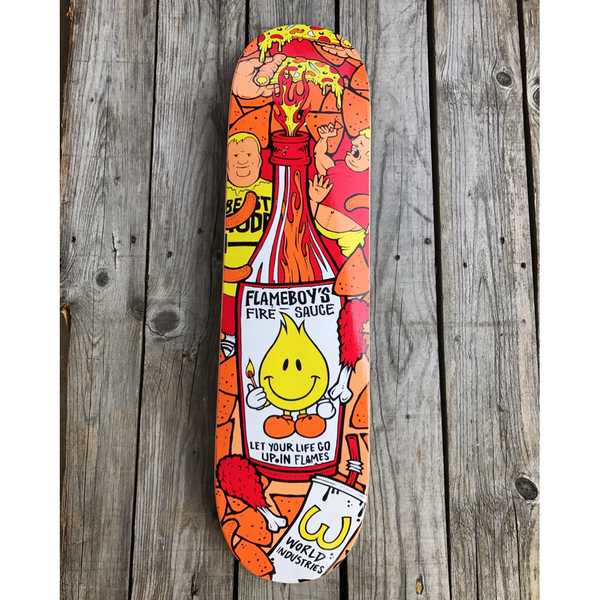 World Industries Flameboy - Fire Sauce skateboard deck: Giant bottle of hot sauce with a smiling yellow flame mascot on the label, surrounded by cartoon figures, chicken drumsticks, pizza and nacho chips, with a World Industries cup at the bottom.