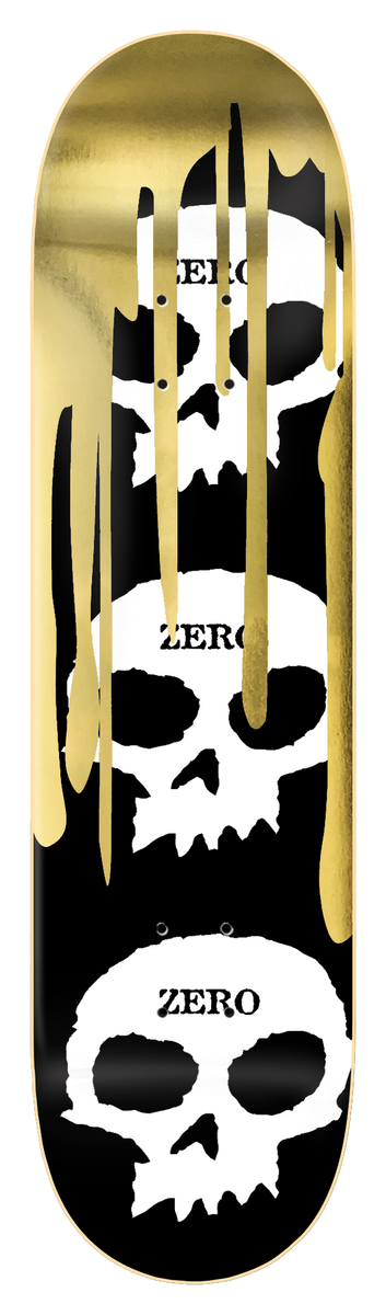 Zero 3 Skull Blood - Gold Foil skateboard deck: Three stacked white Zero skulls on black, each labelled with the brand name, with gold foil drips running down from the top.