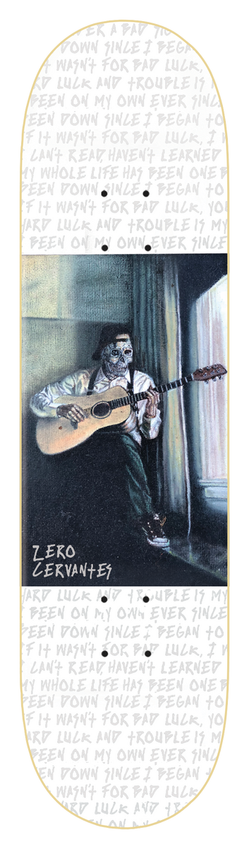 Zero Cervantes - Blues 8.5 skateboard deck: Painted scene of a skeleton-faced man in a cap playing an acoustic guitar beside a window, set in a rectangle on a white deck covered in faint repeated lyric text about bad luck and trouble.