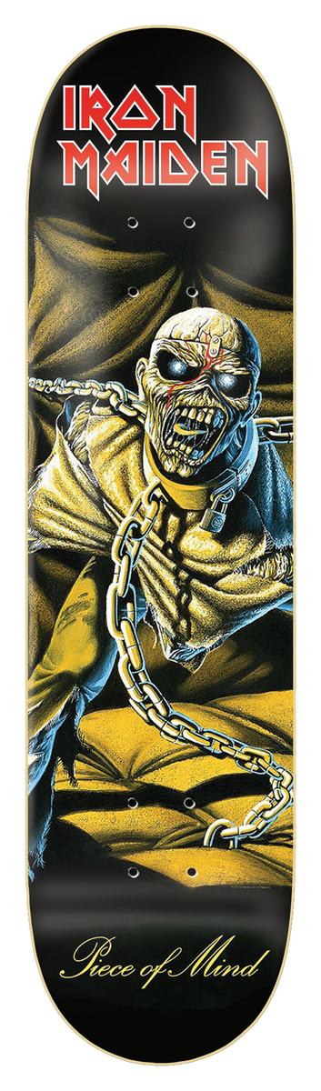 Iron Maiden Iron Maiden - Piece Of Mind skateboard deck: Painted album-cover artwork of a gaunt, chained zombie-like figure with glowing eyes and a red mark on its forehead, sitting in a yellow padded cell. Red band logo at top on black.
