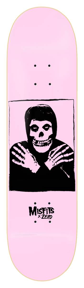 Zero Misfits Fiend - Light Pink (Limited Edition) skateboard deck: Light pink deck with a black print of a skull-faced Misfits figure in a hooded top with arms crossed, in a square frame, with the Misfits x Zero logo below.