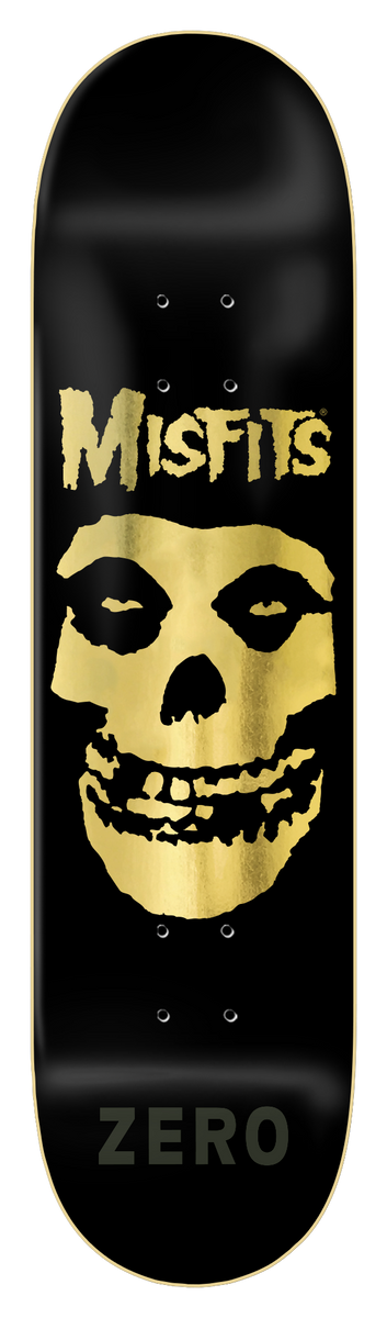 Zero Misfits Fiend Skull - Gold Foil Edition skateboard deck: Black deck with a gold foil Misfits Fiend Skull face in the centre, a gold Misfits logo above it and a dark Zero wordmark near the tail.