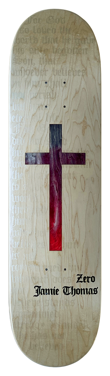 Zero Thomas Die - Cut Cross Natural skateboard deck: Cross fading from purple to red set on bare natural maple, with faint blackletter text running behind it and 'Zero Jamie Thomas' in blackletter at the tail.