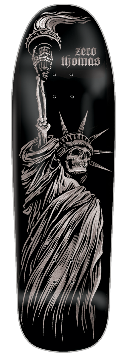 Zero Thomas - Liberty Or Death 9.5 Cruiser skateboard deck: Monochrome silver-on-black illustration of a skeletal Statue of Liberty, with a skull face and bony raised arm holding a torch, drawn in fine engraved linework. Rider name set in gothic lettering at the top beside the torch.