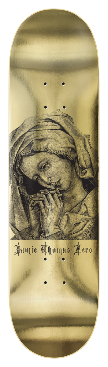 Zero Thomas - Mary Magdalene skateboard deck: Engraved portrait of a veiled woman with hands clasped in prayer, her head bowed, above gothic-script lettering, on a metallic gold deck.