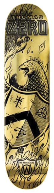 Zero Whosoevers - Thomas - Gold 8.0 skateboard deck: A black engraving-style coat of arms on a gold foil deck, showing a rooster perched on a shield with a Celtic knot, surrounded by flames, with THOMAS ZERO lettered at the nose and The Whosoevers badge at the tail.