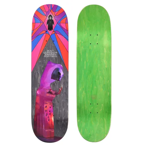 Alien Workshop Montano Crystal Priest skateboard deck: A purple hooded alien figure with raised hands stands on a pink crystalline pedestal against grey stained wood. A radiating pink, orange, blue and purple stained-glass burst fills the top, with a small hooded alien emblem at its centre.