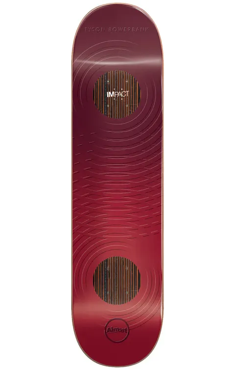 Almost Bowerbank Raised Rings Impact 8.25 skateboard deck: A deep red deck with embossed concentric ripple rings and two dark circular insets showing orange wood-strip texture, one carrying the Impact label. The rider name sits at the nose and the Almost logo at the tail.