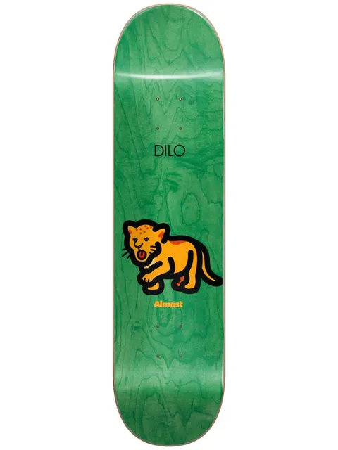 Almost Dilo Mean Pets Impact Light 8.5 skateboard deck: Simple cartoon of a roaring orange spotted cub or big cat with thick black outline, on a green wood-stained deck. 'Dilo' printed above and the Almost name in orange below.