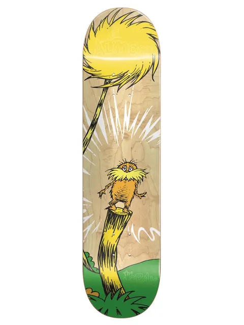 Almost Dr.Seuss Youth Logo R7 skateboard deck: Dr. Seuss's Lorax standing on a tree stump beneath a yellow tufted Truffula tree, with white burst lines, on a natural wood deck with a green grassy base.