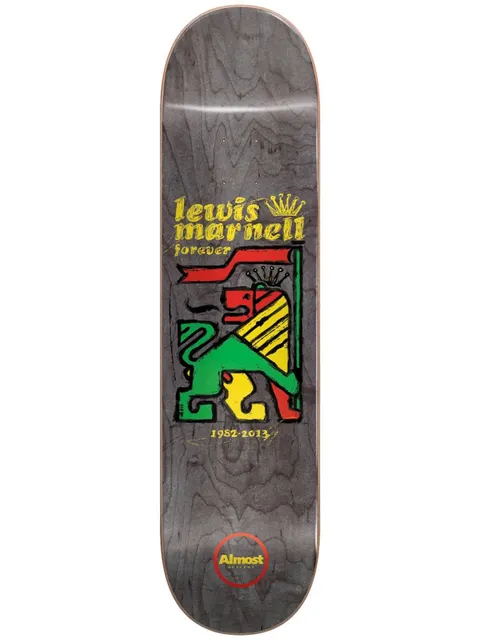 Almost Lewis Rasta Lion R7 8.0 skateboard deck: Rasta-coloured red, yellow and green lion holding a flag, drawn in a rough woodcut style on a grey deck. Lewis Marnell Forever with a gold crown above and the dates 1952-2013 below.