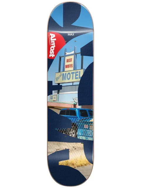 Almost Max Fleabag R7 skateboard deck: Photograph of a Best Motel sign above a blue pickup truck behind a chain-link fence, cut through by large navy blue abstract shapes with faint Cable TV text. Red Almost logo near the nose.
