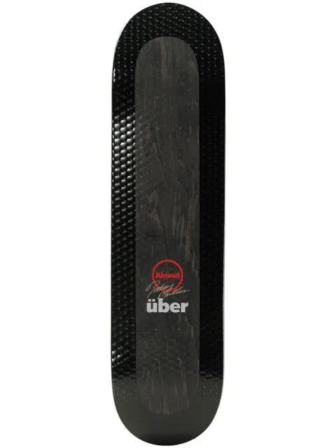 Almost Mullen Uber Black 8.0 R7 skateboard deck: Black deck with a glossy textured bevelled border and a dark wood-grain centre panel carrying a red Almost circle logo, a signature and 'uber' lettering.