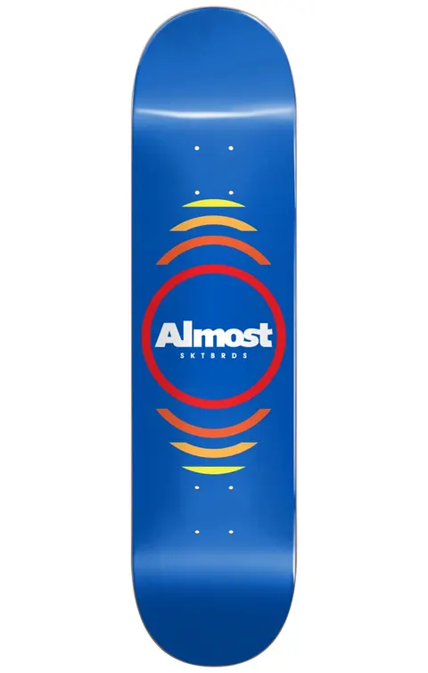 Almost Reflex BLUE 8.0 skateboard deck: A white Almost SKTBRDS logo inside a red ring, with orange-to-yellow arcs radiating above and below, on a plain blue deck.