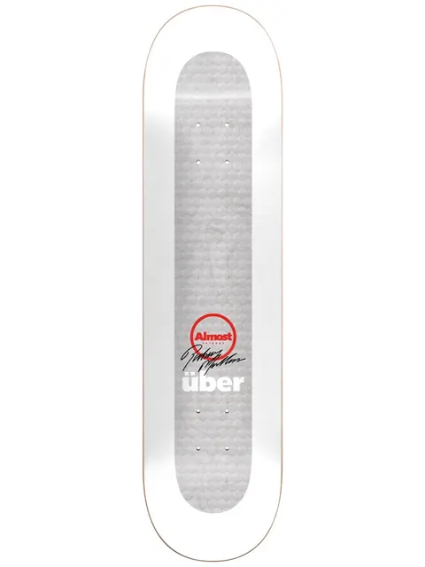 Almost Uber White skateboard deck: Plain white deck with a grey honeycomb-textured central panel, a red circular Almost logo with a black signature, and 'über' in white lettering.