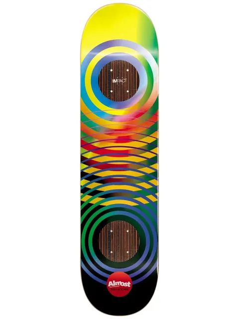 Almost Yuri Gradient Rings Impact 8.5 skateboard deck: Overlapping concentric rings and ellipses run the length of the deck in a rainbow gradient from yellow through red, green and blue to black. Two circular wood-grain panels frame the truck areas, with the Impact name above and a red Almost logo below.