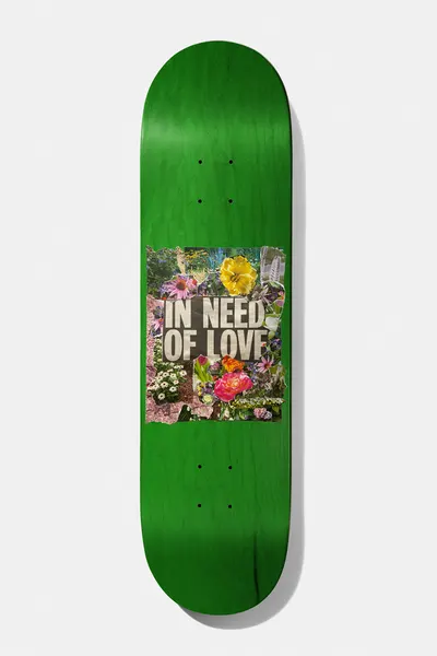 Baker Casper Brooker In Need Of Love 8.25 skateboard deck: Green stained deck with a square torn-paper collage of garden flowers and the words In Need of Love across the middle.