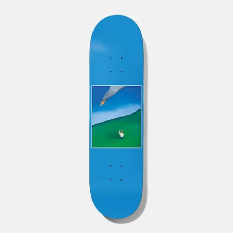 Baker Hawk Clear Blue Sky 8.125 skateboard deck: A small framed painting in the middle of a blue deck shows a man standing on a green hillside, pointing a gun at a burning plane trailing smoke across a blue sky.