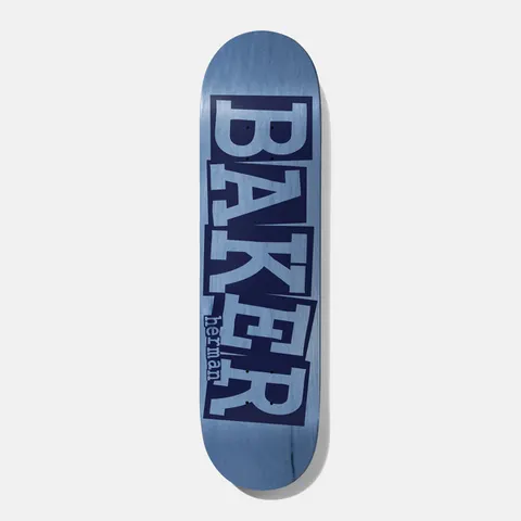 Baker Herman Ribbon Blue Veneer 8.25 skateboard deck: Large Baker ribbon logo with stacked, cut-and-pasted style letters in navy and pale blue over a blue stained veneer, with the rider name herman in small lettering beside it.